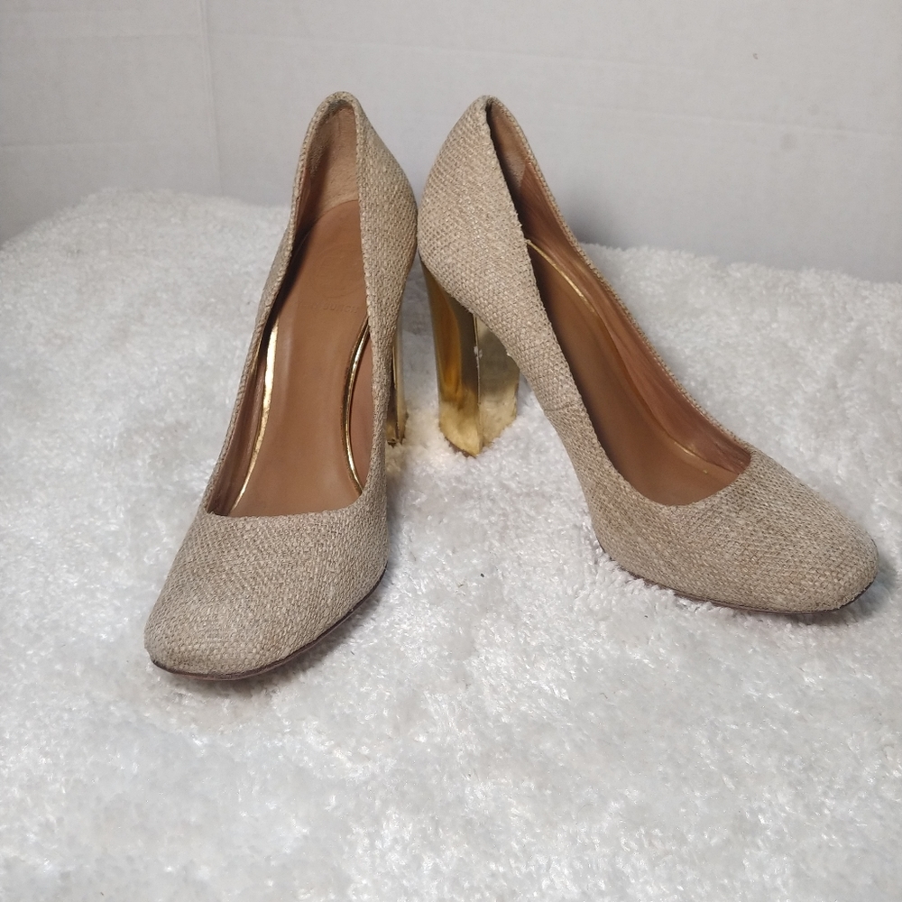 - Tory Burch Madison Golden Pumps